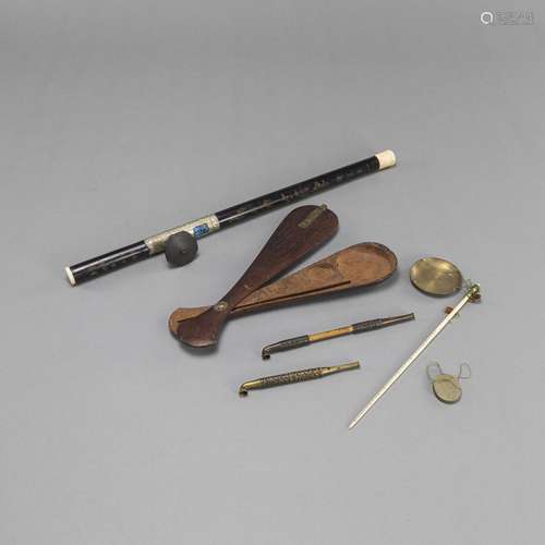 AN OPIUM PIPE, TWO KISERU PIPES, AND AN OPIUM WEIGHING SCALE