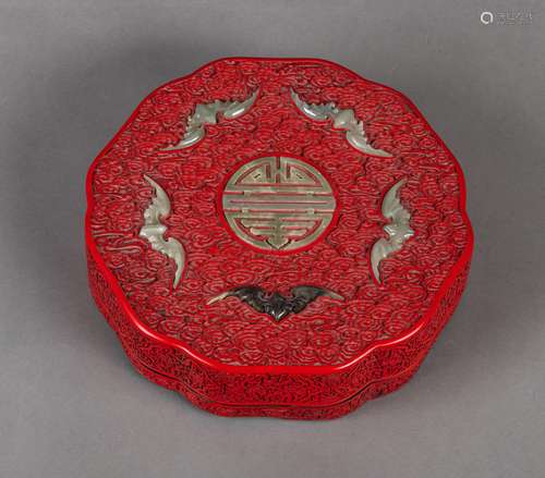 A JADE-INLAID FLORIFORM CINNABAR-LACQUER BOX AND COVER