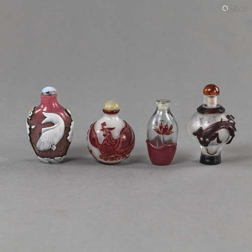 FOUR GLASS SNUFF BOTTLES DECORATED WITH CARP, PHOENIX BIRD A...