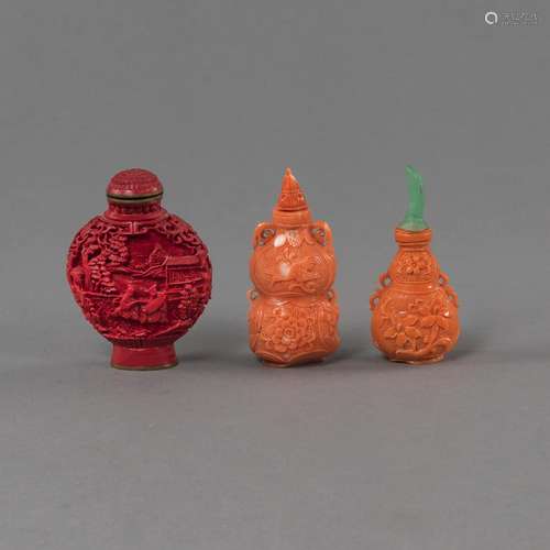 TWO CORAL SNUFF BOTTLES IN THE SHAPE OF A GOURD AND A RED SN...