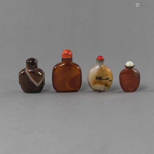 FOUR AGATE OR STONE SNUFF BOTTLES, TWO WITH CORAL STOPPERS