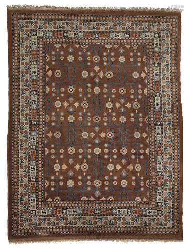 A KHOTAN CARPET WITH BLOSSOM DESIGN