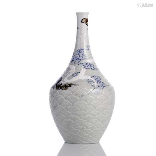 A BLUE AND WHITE SETO PORCELAIN VASE WITH DRAGON AND WAVES