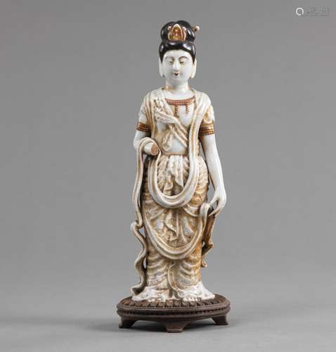 A STANDING KANNON PORCELAIN FIGURE