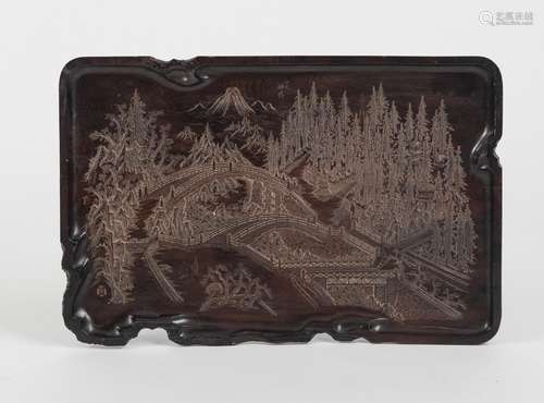 A WOOD TRAY WITH A CARVED RIVER LANDSCAPE AND BRIDGES