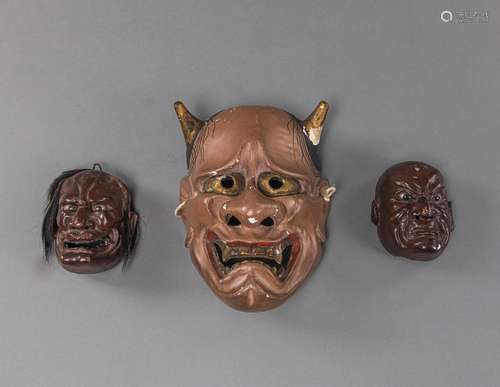 THREE PAINTED AND LACQUERED CARVED WOODEN NÔ MASKS