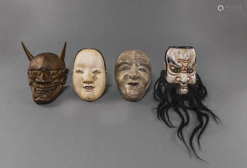 THREE CARVED AND PAINTED WOODEN NÔ MASKS AND A WOODEN HANNYA...