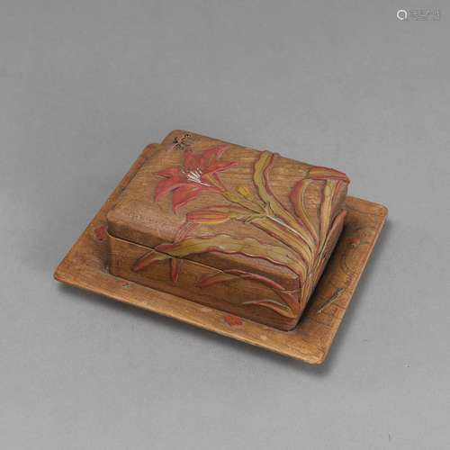 A LILY RELIEF CARVED WOOD BOX ON A TRAY