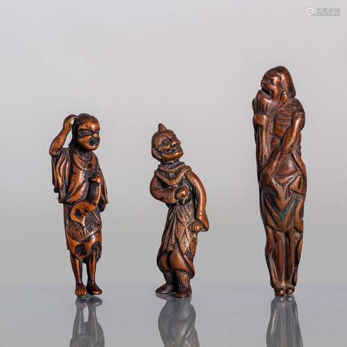 A GROUP OF THREE CARVED WOOD NETSUKE OF SENNIN