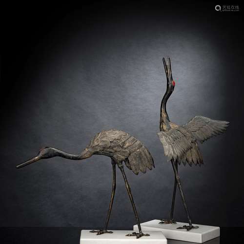 TWO LARGE BRONZE OKIMONO OF CRANES ON MARBLE PLINTHS