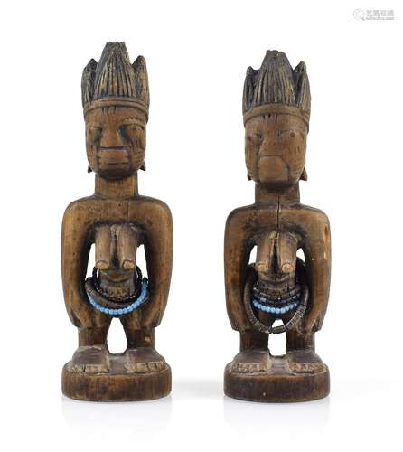 A PAIR OF IBEDJI WOOD FIGURES