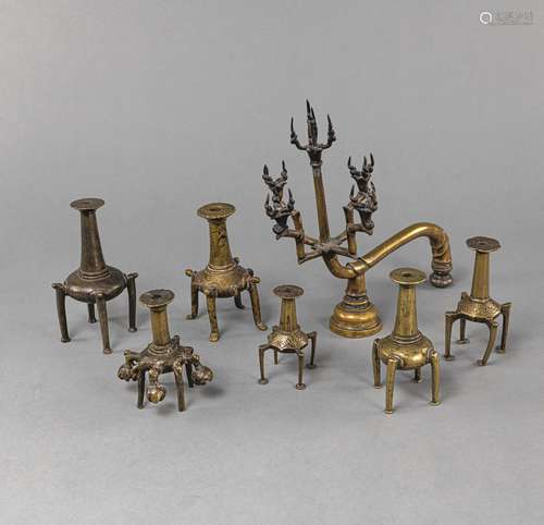 SEVEN BRONZE CANDLESTICKS