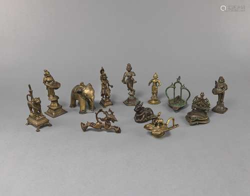 A GROUP OF TWELVE WORKS OF ART, OIL LAMPS, OX ET AL.