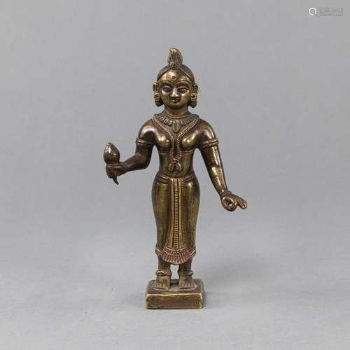 A BRONZE FIGURE OF RADHA