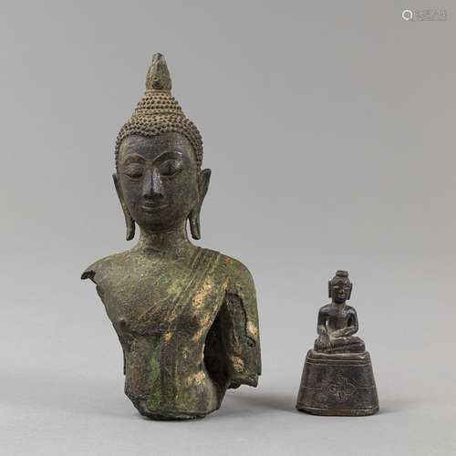 A BRONZE TORSO OF A BUDDHA AND A SMALL BUDDHA STATUE