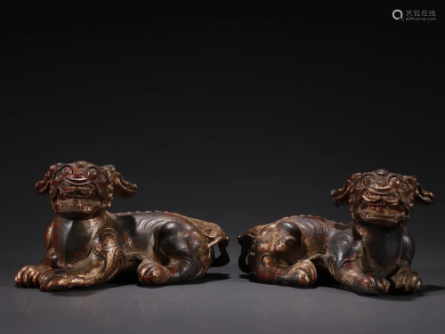 A Pair of Bronze Painted Gold Lion Ornaments