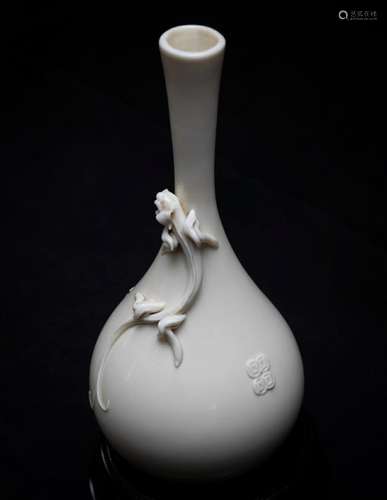 A Chinese white porcelain bottle