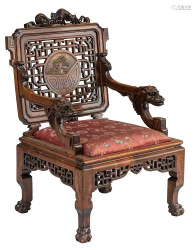 A fine chinoiserie armchair with carved dragons and an openw...