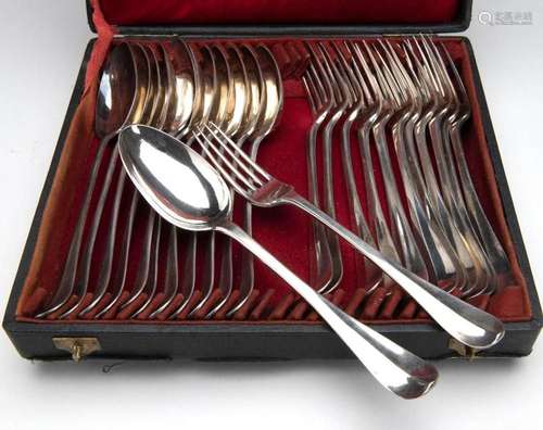 Twelve Dutch silver table spoons and twelve table forks