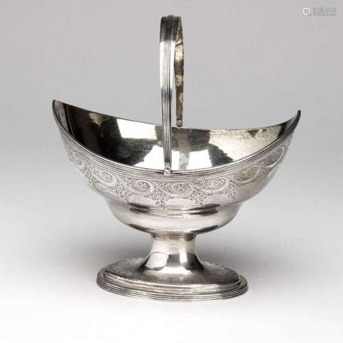 An English silver and gilt sugar bowl with swing handle