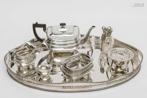 A three-piece English silver tea service with English plated...