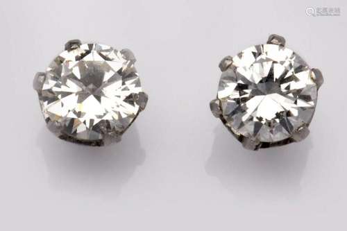 A pair of platinum diamond single stone earstuds