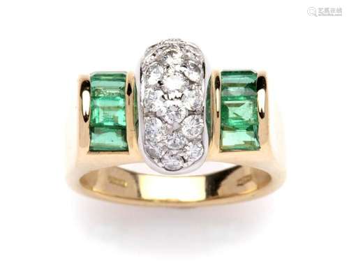 An 18k gold emerald and diamond ring