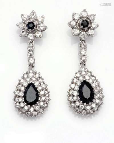 A pair of 14k white gold sapphire and diamond earrings