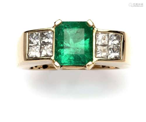 A 14k gold emerald and diamond ring