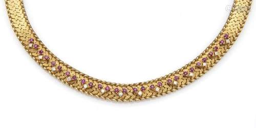 An 18k gold ruby and diamond necklace