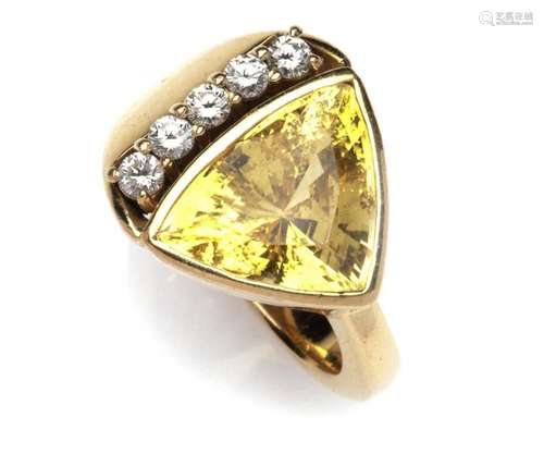 An 18k gold yellow sapphire and diamond ring