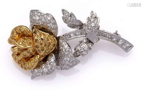 A 14k gold coloured diamond brooch