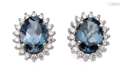 A pair of topaz and diamond earrings