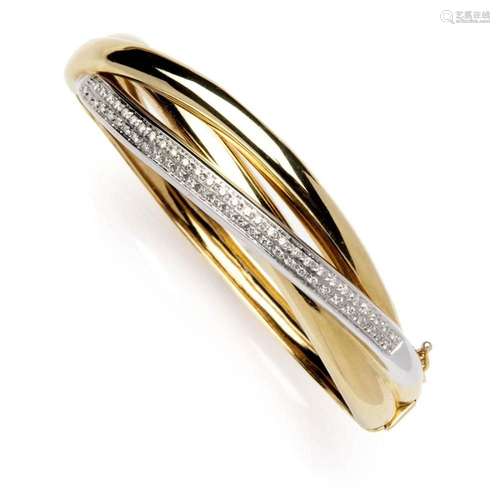 An 18k two colour gold diamond bangle