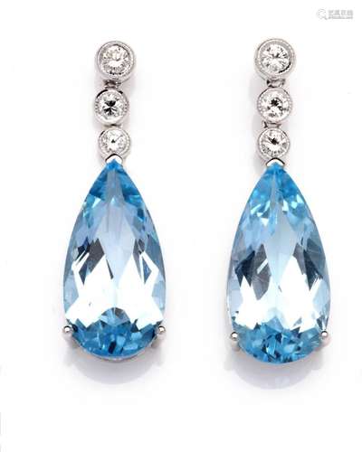 A pair of 14k white gold topaz and diamond earrings