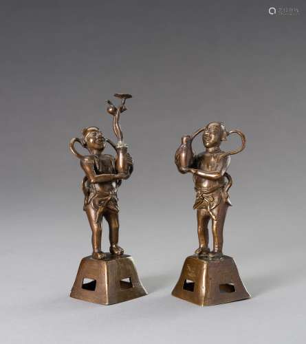 TWO BRONZE FIGURES OF BOYS HOLDING VASES