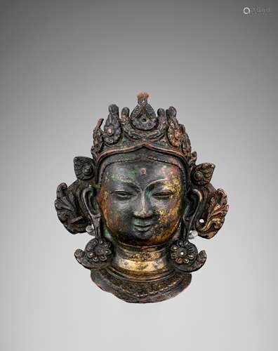 A COPPER REPOUSSE NAVADURGA MASK