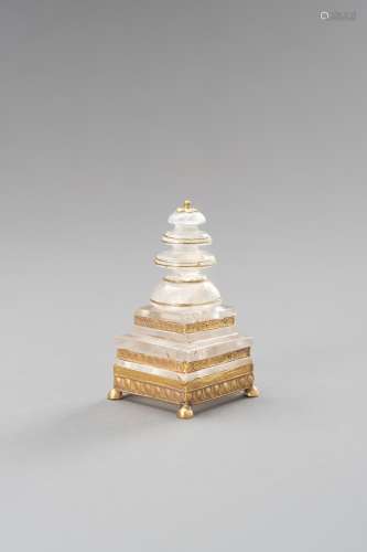 A ROCK CRYSTAL STUPA WITH GOLD APPLICATIONS