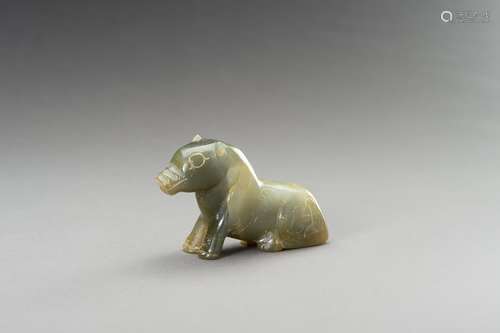 AN ARCHAISTIC SEA-GREEN HARDSTONE FIGURE OF A BEAST, 20TH CE...