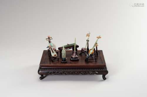 A GROUP OF EIGHT HARDSTONE MINIATURE MODELS OF MUSICAL INSTR...