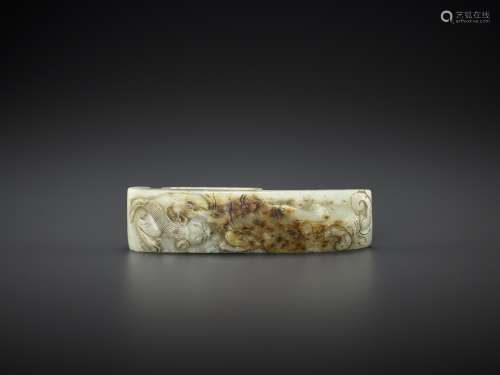 AN ARCHASITIC JADE SCABBARD SLIDE WITH DRAGON AMID CLOUDS, E...