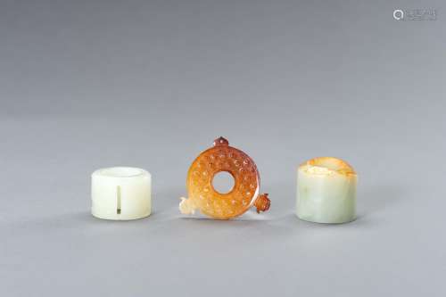 A JADE GROUP COMPRISING TWO ARCHER'S RINGS AND AN ARCHA...