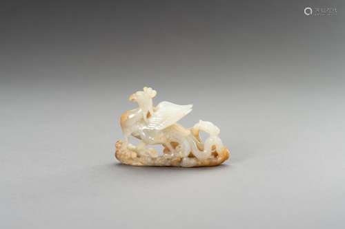 A PALE CELADON AND RUSSET JADE 'PHOENIX' CARVING, ...