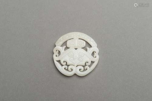 AN ARCHAISTIC WHITE JADE PENDANT, 1900s