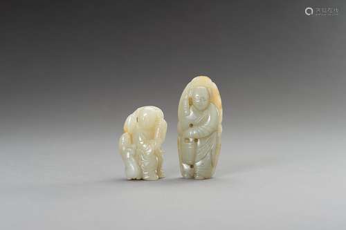 † TWO CELADON AND RUSSET JADE FIGURINES, 1900s