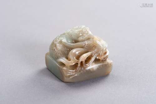 † A CELADON AND RUSSET JADE 'QILIN' SEAL, LATE QIN...