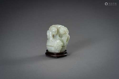 † A PALE CELADON JADE GROUP, 20th CENTURY