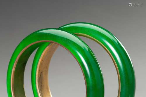 A PAIR OF GLASS IN IMITATION OF JADEITE BANGLES