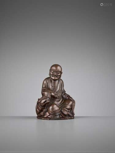 A BAMBOO FIGURE OF A LUOHAN AND BUDDHIST LION, QING