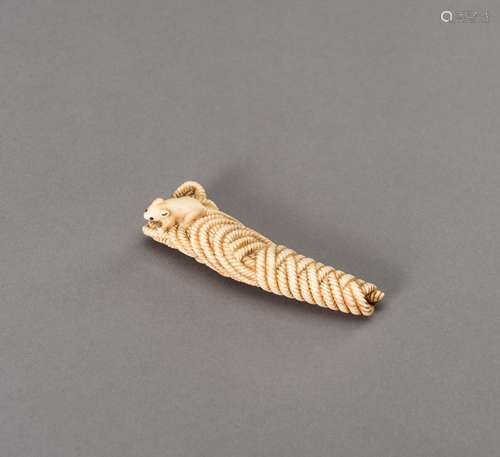 A STAG ANTLER NETSUKE OF A RAT ON ROPE